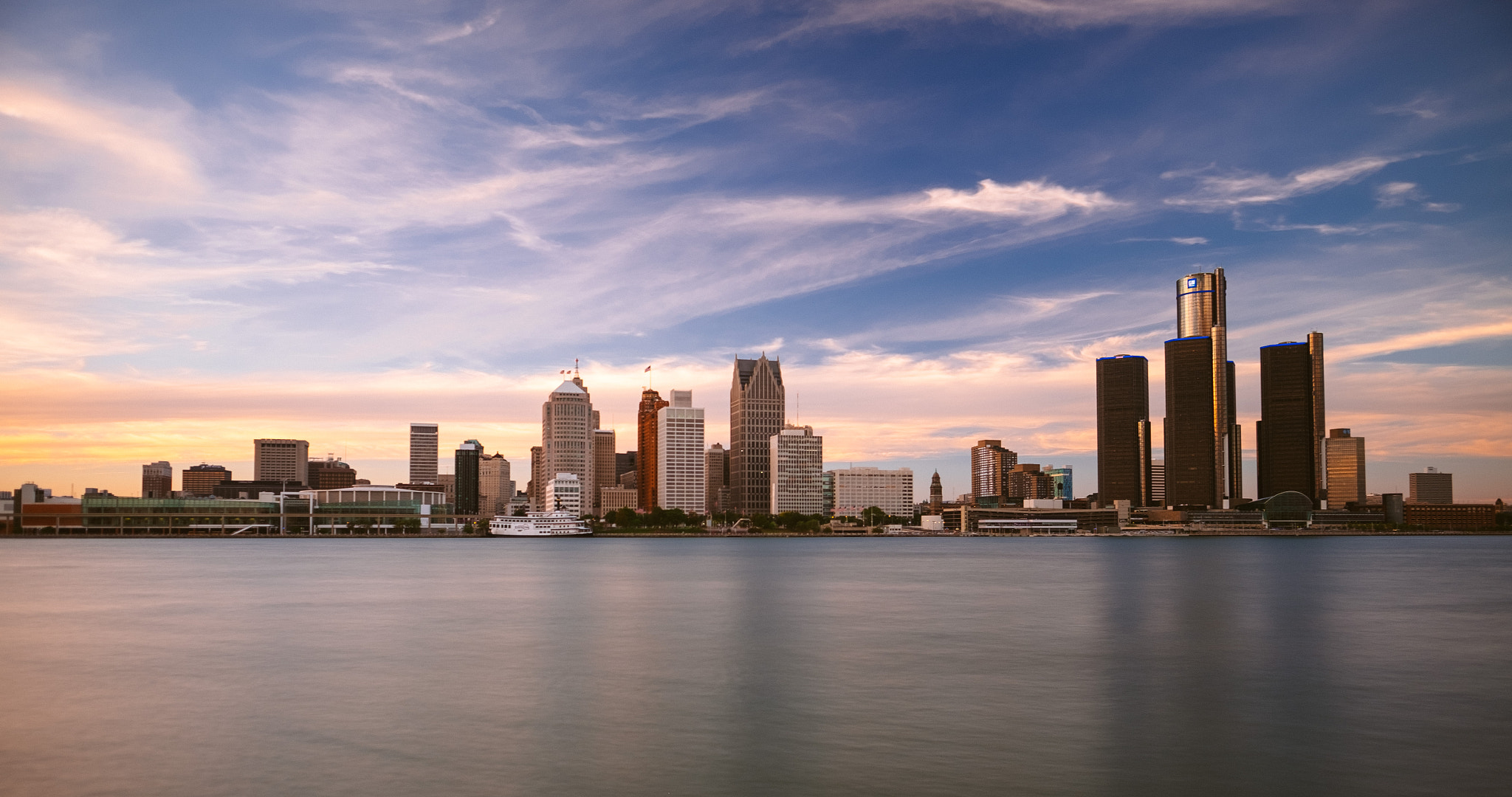 Detroit skyline at sunset over the Detroit River
